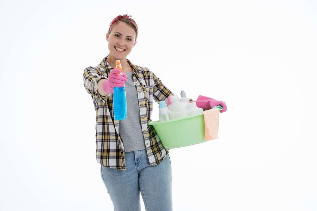 perimenopause age caucasian woman, standing with cleaning products