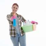 perimenopause age caucasian woman, standing with cleaning products